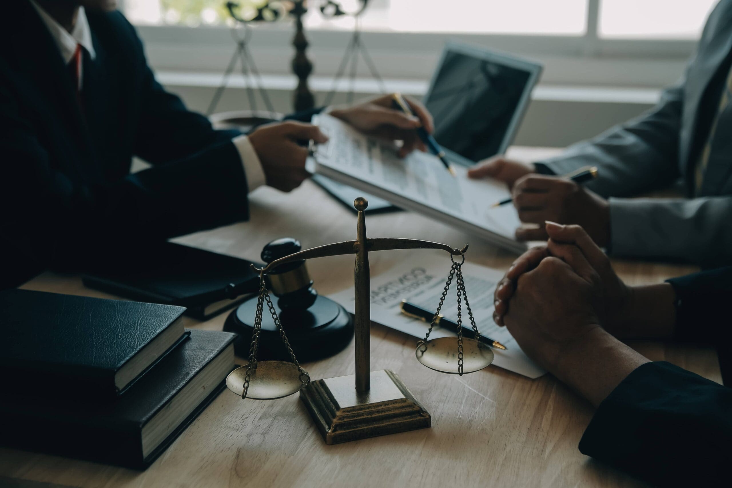 South Carolina lawyers reviewing virtual deposition services contract with a gavel and scales of justice, signifying certified legal support.